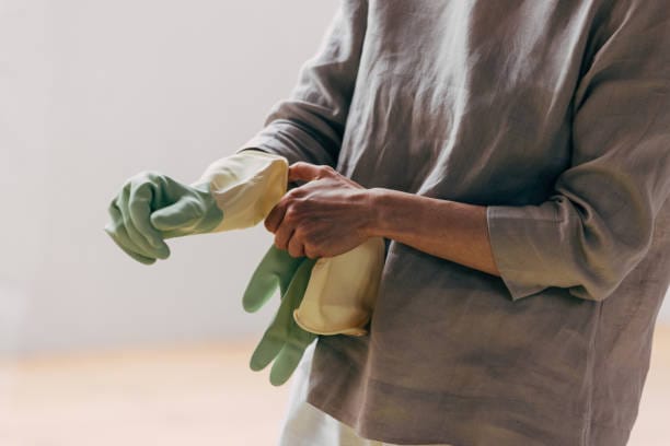 Preparing PPE for house cleaning service visit